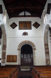 The church interior looking west showing the Norman arch - August 2009